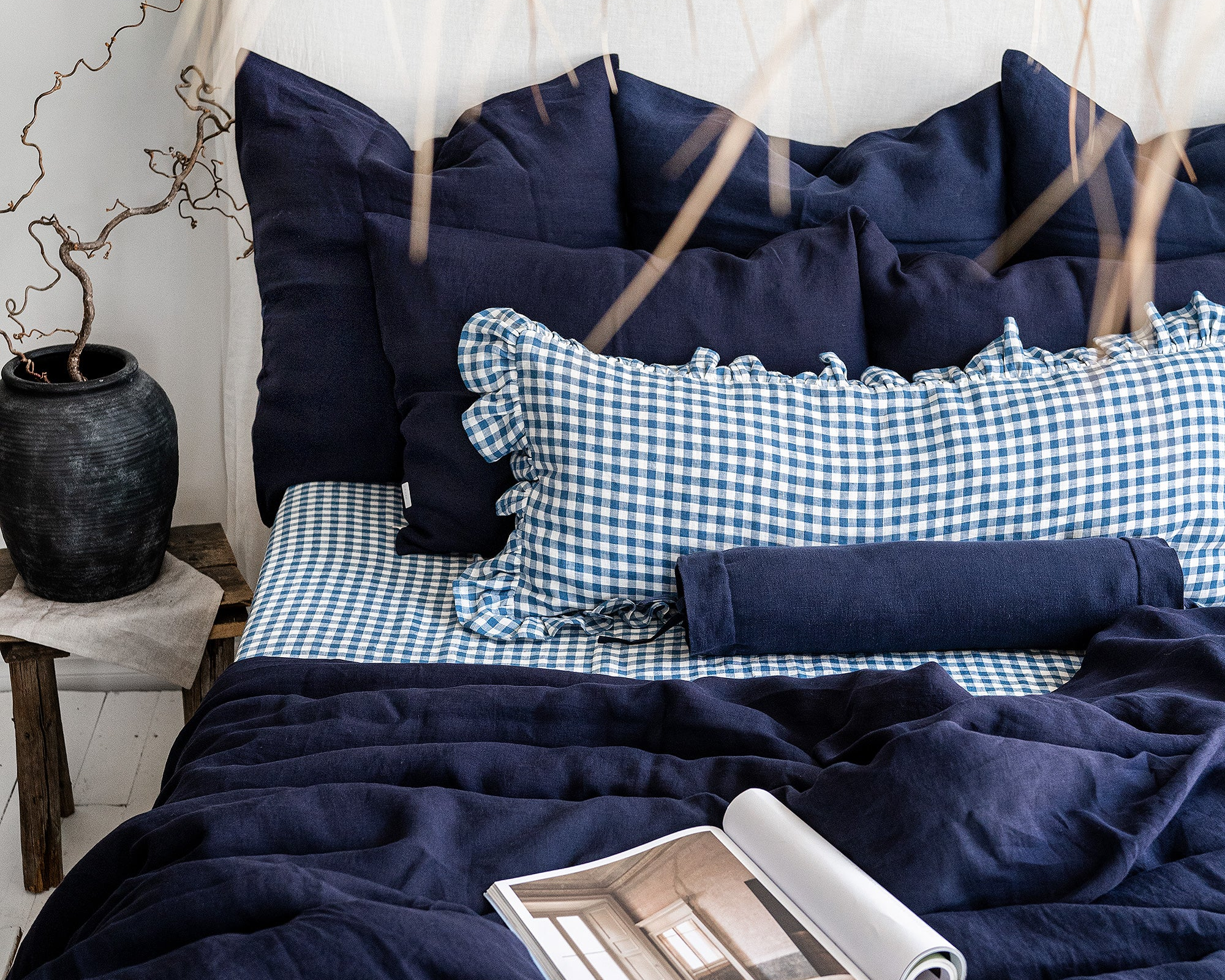 dark blue linen bedding set with blue gingham ruffled lumbar